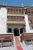 Ladakh - Hemis Gompa, the main monastery halls with the characteristc red painted windows and woden balconies on white washed faades 